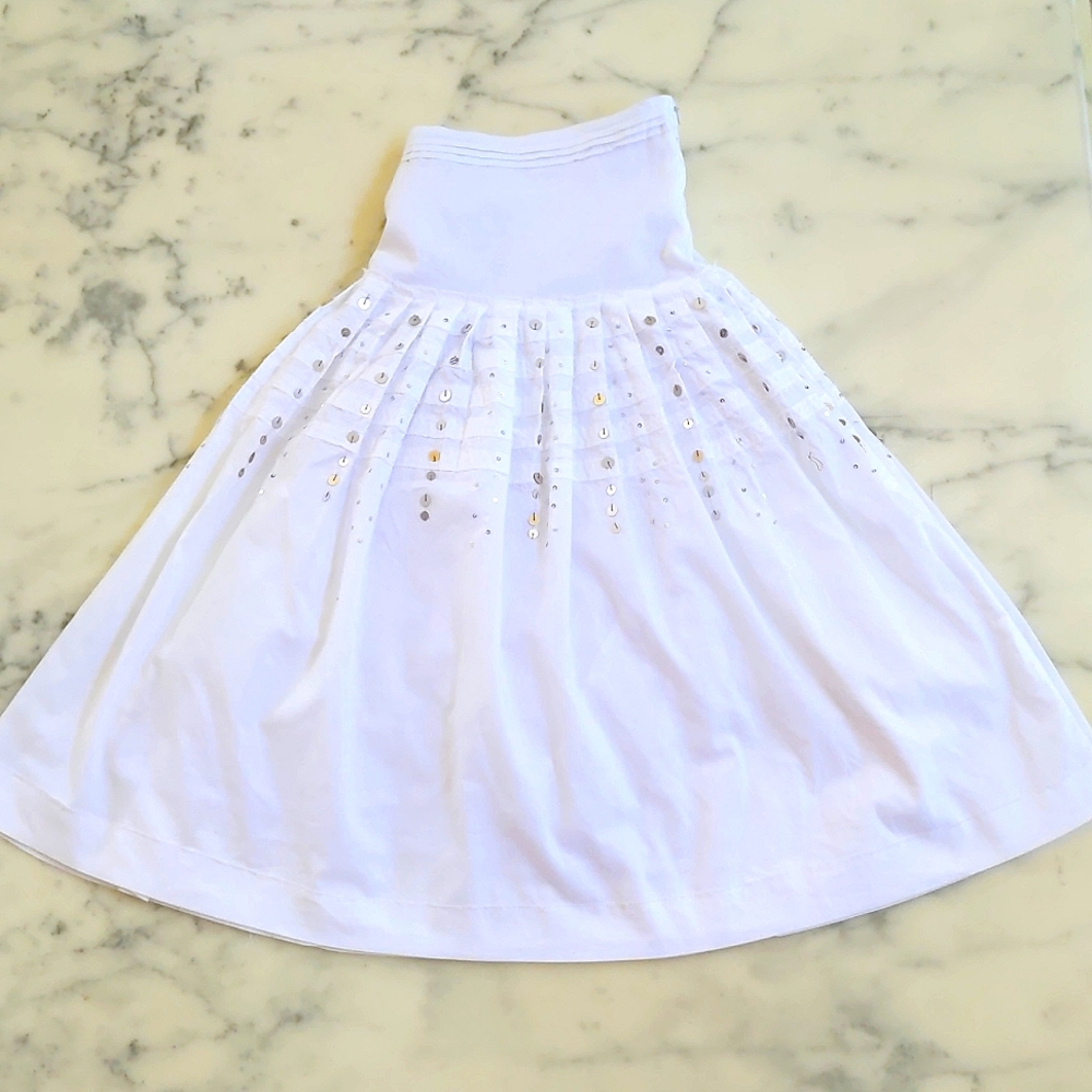 NWOT. 100% Cotton Fully Lined Skirt with gold and silver sparkling decorations.